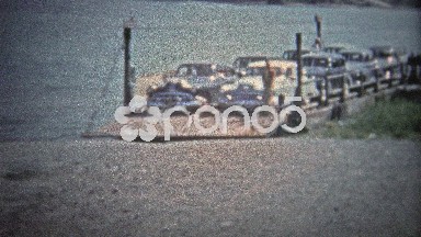 Tennessee, USA - 1954: Car Ferry Unloading at Rural Tennessee River Spot