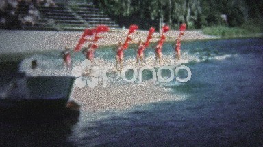 FT. LAUDERDALE, USA - 1957: Waterskiing show with women skiing with red festive