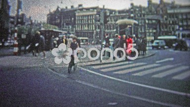 Cologne, Germany - 1966: Morning commuter traffic fills the city streets