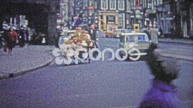 Cologne, Germany (1966): A poor man biking a large quantity of unknown goods