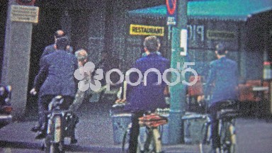 Cologne, Germany (1966): Business people biking to work in full formal fashion