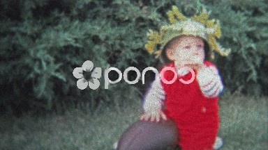 Dallas, TX - 1971: Parents Put on Military Combat Helmet for Dress Up Day