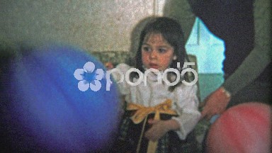 BOULDER, CO. USA - 1974: Giant punching bag balloon birthday surprise activity