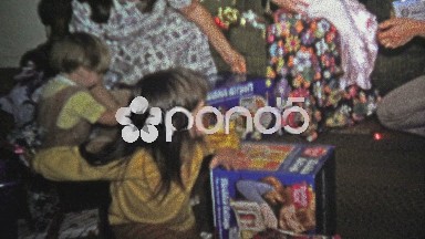 1973: Kids opening Christmas gift toys with flower dresses around.