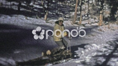 1973: Taking turns pulling a sled of firewood across the winter snow.