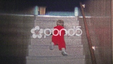 1973: Baby's momentous first climb up staircase.