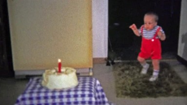 1973: One year old awkwardly walks to birthday party cake and burns himself on