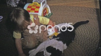 1973: Boy bothering a patient cat with new Christmas toy.