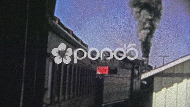 1972: Polluting old coal firing train pulling out of the station.