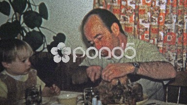 1973: Dad teaching son about how to carve a holiday turkey.