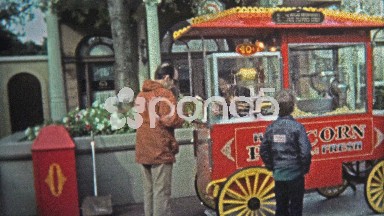 1969: Walt Disney World popcorn 40 cents old-style food vendor cart.
