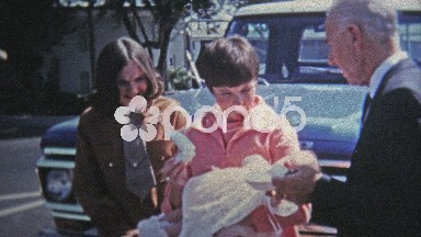 1969: Young mother has baby ready for baptism christening.