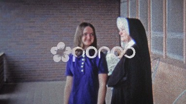 1971: Catholic nun blessing young girl before she travels away.
