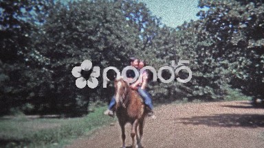 1971: Girls riding horse slow motion rideby.