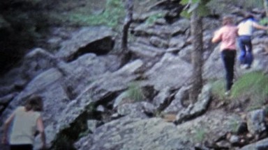 1971: Girls playing around and hiking rocky boulder trail.