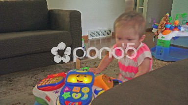 Cute baby being expressive in family house.