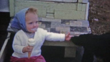 Boulder, Colorado (1951): Girl sharing ice cream with family dog.