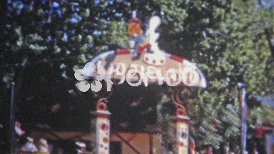 Denver, Colorado (1951): Kiddieland Amusement Park girl enjoying the latest rides.