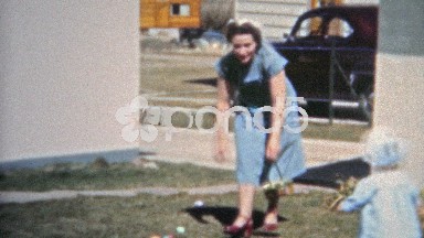 Boulder, Colorado (1951): Mom setting up Easter egg hunt for the children.