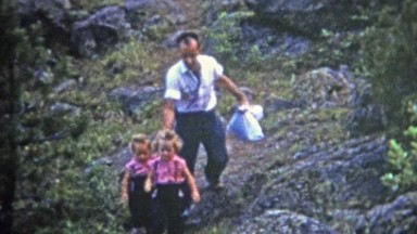 1952: Dad taking small daughters on wilderness hike.