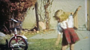 1953: Little girl mimics ballroom dancing with kicking.