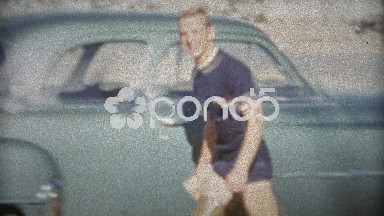 1953: Young athletic teenager washing car in thighboots.