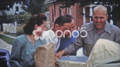 1953: Proud new mom and dad coming to dinner with baby.