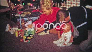 1968: Mom dad baby play new Christmas gift toy