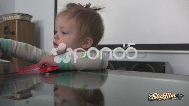 Denver, Colorado, United States: Rascal Baby Getting Into Trouble Pulling Out Pieces of a Game.