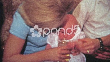 1968: Drunk parents pretend to give baby a taste of the booze.