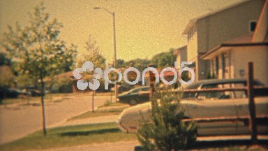 1974: Suburban housing sprawl of the 70s with car closeups.