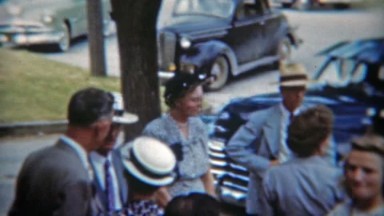1951: Community Members Gather and Leave Outside Church