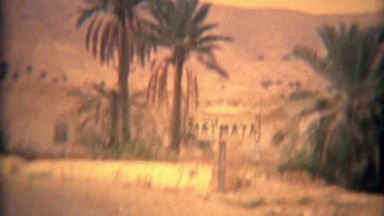 1975: Driving into Matmata Arab desert landscape riding mule.
