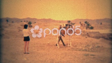 1975: Western Women Riding a Camel Led by Native Guide in Matmata, Tunisia