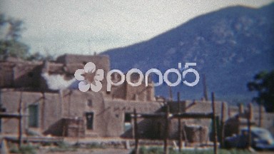 1955: Parking by the church at the Taos Native American Pueblo.