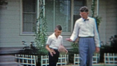 1953: Dad and Son Playing Basketball in Driveway, Formally Dressed.