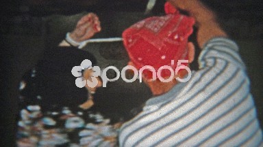 1956: Couple playing twisted rope tied together intimate game.