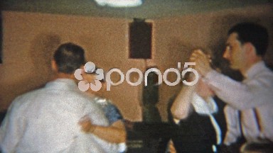 1955: Father dancing with mother in-law in cement lower level residence.