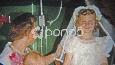 1955: Girl's first catholic communion cake party in family basement.