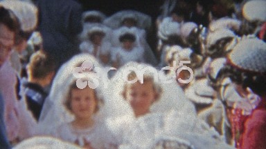 1955: Girls first communion with mother, classmates, brother and neighbors.