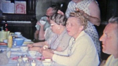 1955: Family drinking Budweiser Beer at the kitchen table during thanksgiving