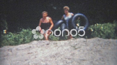 1956: Mother and Daughter Inner Tubing on Private Summer Lake House Property.