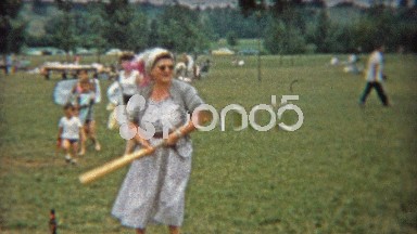 1956: Grandma and aunt try playing baseball with the family in the park.