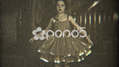 1936: Young Girl Practicing Dance in Fancy Dress Indoors