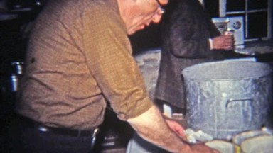 1965: Man Enjoying Cream Dip on Potato Chips