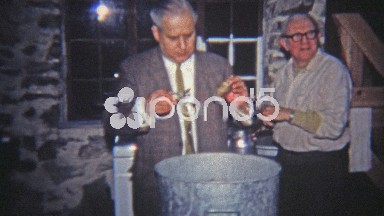 1965: Man Showing Off Pot of Oysters to Be Cooked.