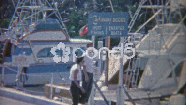1952: Sports Fishing Docks Waiting for Sailing Boat Charter