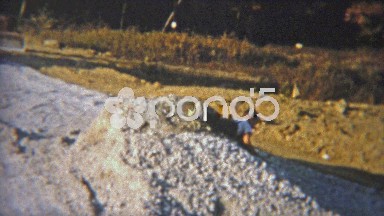 1951: Kid playing in mound of construction dirt.