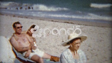 1959: Kids playing with dad and gives stoic grandma some love.