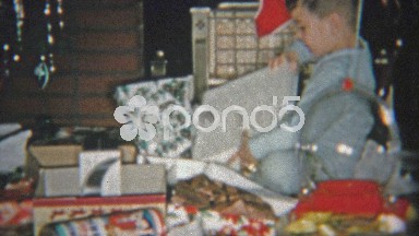 1954: Boy gets toy gun for a Christmas gift.